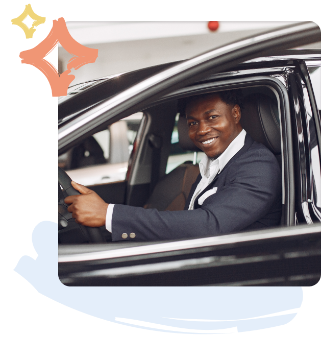 a man in a car smiling